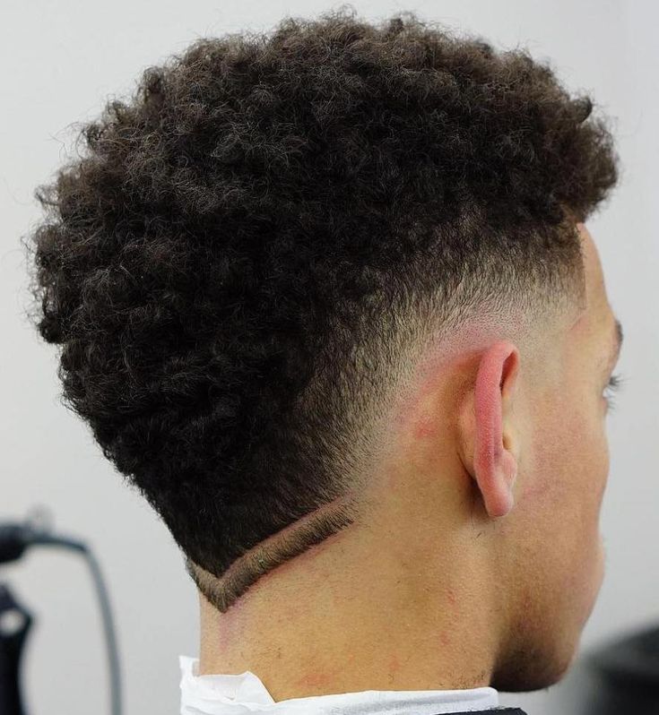 Men's Curly and Afro Mohawk Haircuts with Fade